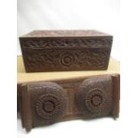 C20th carved padauk wood stationery box, the top extensively carved with a peacock and meandering