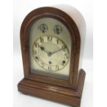 C20th arched top mahogany cased bracket clock, silvered dial with Arabic chapter and subsidiary