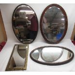 Three oval wood framed mirrors and a rectangular brass framed mirror