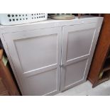 Painted pine shelf unit enclosed by pair of panelled cupboard doors