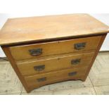 Early c20th satin beech chest of three long drawers with embossed Art Nouveau handles W81cm D49.