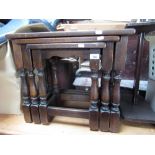 Nest of three oak occasional tables on turned supports