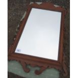 C19th mahogany framed rectangular wall mirror with carved floral supports and carved gilt slip