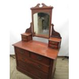 Early C20th mahogany dressing table, swing bevel edged mirror supported by carved scroll arms