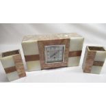 An Art Deco period three piece variegated marble and onyx clock garniture. Martini eight day