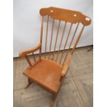 Contemporary oak and pine Shaker style rocking chair with spindle back, solid seat on turned ring