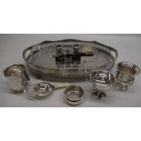 Silver plated salver with raised pierced gallery on bird claw feet with a selection of various