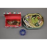 Metal tin and small cardboard box with costume jewellery and a glass paper weight