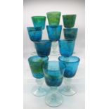 Collection of Mdina blue and yellow glass goblets with spherical knop stems, all signed Mdina Glass,