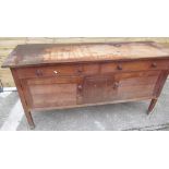 Early/mid C20th oak sideboard with two drawers above two doors, on block supports with turned wood