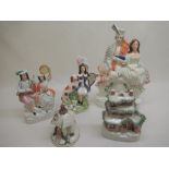 Victorian Staffordshire group of a Scotsman with bagpipes and his wife, H35cm, four other pieces