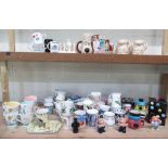 Collection of various cups and mugs including Ringtons bunny mugs, Liquorish All Sorts mug, money