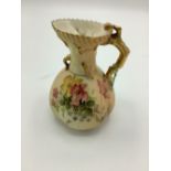 Early C20th Royal Worcester jug, coral handle and blush ivory ground decorated with roses with