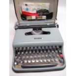 Late 1950s/early 1960s Olivetti Lettera 22 portable typewriter in original case complete with two