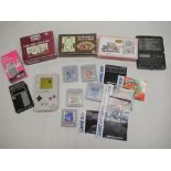 Vintage Nintendo Game Boy complete with a selection of games, three Nintendo Multi Screen handheld