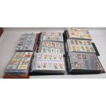 Eight folders of cigarette cards