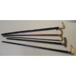 Collection of five walking canes with bone or horn handles two in form of animals in various woods