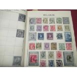 Small stamp album containing a small collection of stamps including Canada France, French