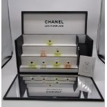 Chanel - Les Parfums stepped display stand containing factice (dummy) No.5 and Mademoiselle