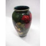 Moorcroft ovoid vase decorated in Hibiscus pattern on a green ground, impressed marks, green