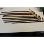 Collection of eight antler handled walking sticks of various woods