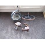 Two jam pans, cast metal barrow wheel and two shoe lasts