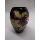 Moorcroft ovoid vase decorated in Hibiscus pattern on a blue ground, impressed marks and blue