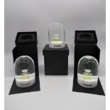 Chanel - Set of three Christmas snow globes depicting Chanel perfume bottle with snowy surround (