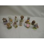 Eleven Beswick Beatrix Potter figurines including "Hunca Munca Sweeping", "Goody Tiptoes", "And This