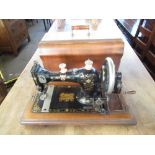 EWS Federation "Family Hand Sewing Machine" with gilt transfer detail in original walnut case