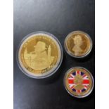 Gold plated Sir Winston Churchill portrait of a British statesman commemorative coin, and two ERII