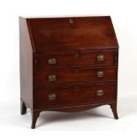 Property of a lady - an early 19th century George III/IV mahogany fall-front bureau, with three long