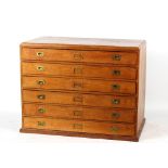 Property of a deceased estate - an oak six-drawer plan chest, 47.25ins. (121cms.) wide.