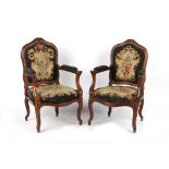 Property of a lady - a pair of 19th century Continental carved fauteuils with floral needlework