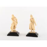 Property of a lady - a pair of late 19th / early 20th century carved ivory figures, one modelled
