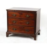 Property of a lady - a George III mahogany chest of three long graduated drawers with brushing