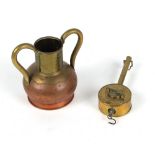 Property of a lady - an early 20th century brass & copper two-handled ewer, 9.8ins. (25cms.) high;