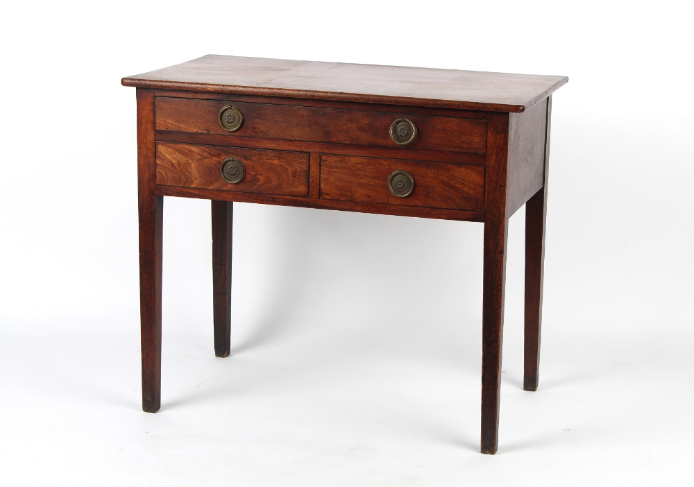 Property of a lady - an early 19th century George III/IV mahogany lowboy, with three drawers &