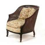 Property of a lady - an early 20th century carved mahogany framed double skinned bergere.
