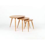Property of a deceased estate - a nest of three Ercol light elm 'Pebble' tables, the largest 25.