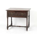 Property of a lady - an early 18th century & later carved oak side table with frieze drawer,