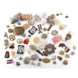 Property of a deceased estate - a box containing military & other cap badges, cloth badges, etc.,