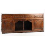 Property of a lady - an 18th century George III oak dresser base, with dog kennel, 81.5ins. (
