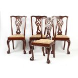 A set of four Chippendale style carved side chairs, with drop-in seats (4).