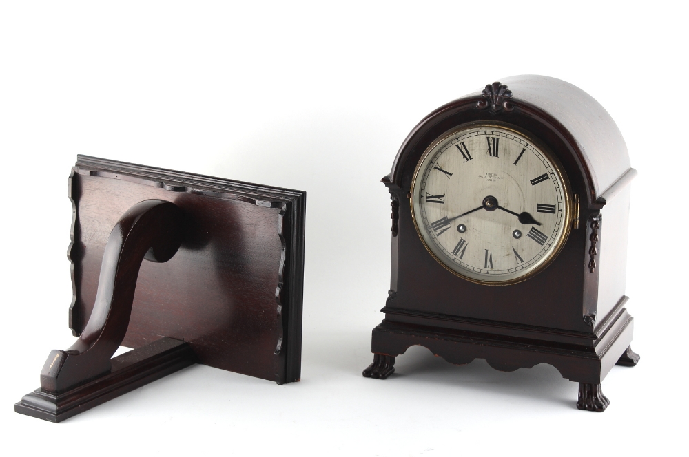 Property of a deceased estate - an early 20th century mahogany arched cased mantel clock with