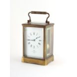 Property of a deceased estate - a 19th century brass corniche cased carriage clock, striking on a