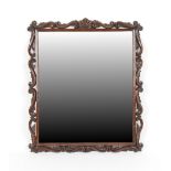 Property of a deceased estate - a carved oak rectangular framed wall mirror with scroll & leaf