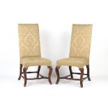 Property of a lady - a pair of early 18th century walnut & later upholstered high-back chairs,