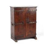 Property of a lady - a 16th century style oak two-door cupboard, enclosing shelves & drawers, on