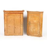 Property of a gentleman - an early 19th century pine corner wall cabinet enclosing painted